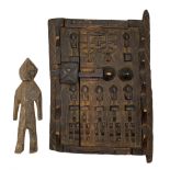 African Dogon granary door heavily carved with stylised flowers etc 28cm x 22cm and a small carved