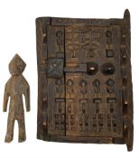 African Dogon granary door heavily carved with stylised flowers etc 28cm x 22cm and a small carved