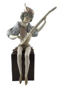 Lladro figure of a mediaeval boy playing a mandolin