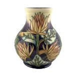 Moorcroft 'Burdock' pattern baluster vase designed by Phil Gibson H16cm