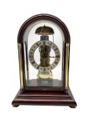 Contemporary Hermle 8-day mantle clock - in a round toped fully glazed case on a rectangular plinth