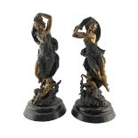 Pair of 19th century gilded spelter classically draped female figures with cherubs at their feet on