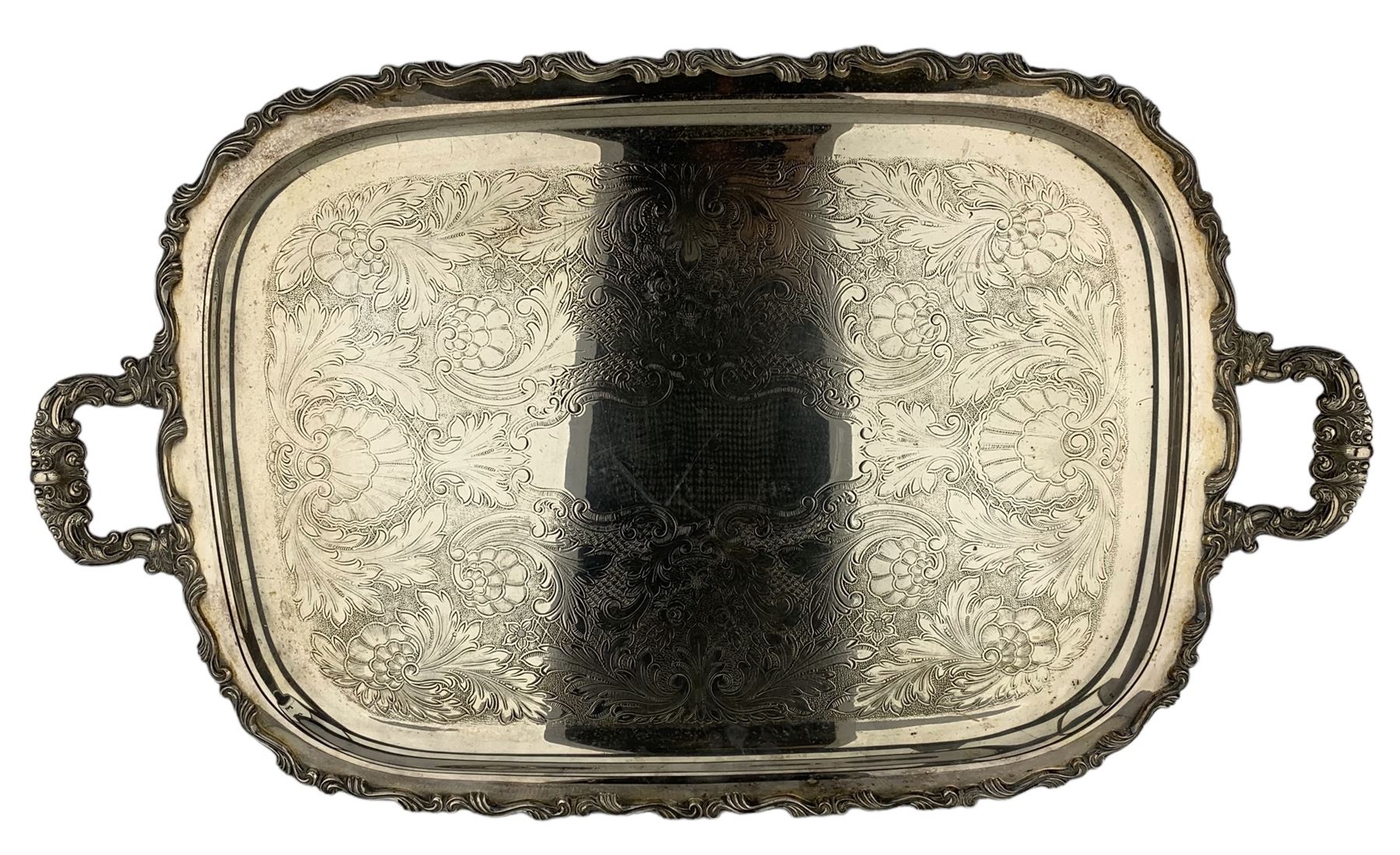 Oneida silver-plated twin handled tea tray with floral engraved decoration and acanthus moulded bord