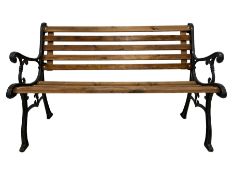 Black painted cast iron and wood slated garden bench