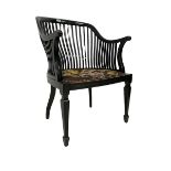 Early 20th century ebonised elbow chair