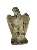 Composite stone garden ornament or water feature in the form of an eagle clutching a fish in its tal
