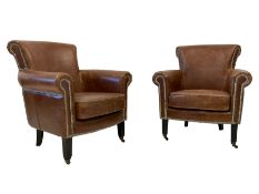 Pair traditional shaped armchairs