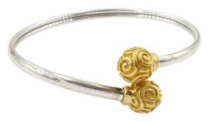 9ct white gold bangle with yellow gold ball finials with swirl decoration