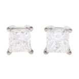 Pair of white gold princess cut diamond stud earrings