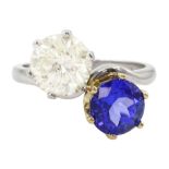 Platinum round brilliant cut diamond and tanzanite crossover ring