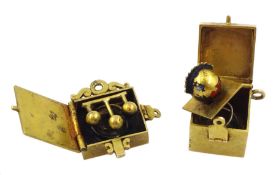 Two 9ct gold jack in the box charms