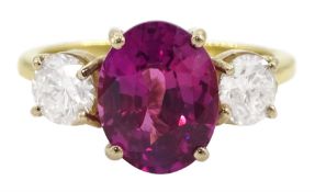 18ct gold three stone oval cut pink sapphire and round brilliant cut diamond ring