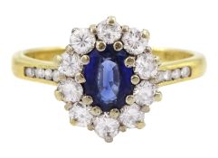 18ct gold oval cut sapphire and round brilliant cut diamond cluster ring