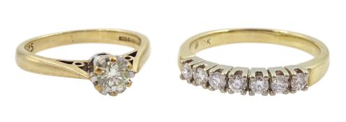 Gold seven stone round brilliant cut diamond ring and a gold single stone diamond ring