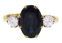18ct gold three stone oval cut sapphire and round brilliant cut diamond ring