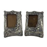 Pair of Edwardian silver photograph frames embossed with a scene from Longfellows Hiawatha with a kn