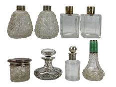 Silver mounted glass scent bottles and jars including a pair of rectangular form glass jars with pla