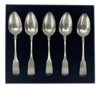 Five William IV Irish silver fiddle pattern table spoons engraved with a crest of a deer Dublin 1834