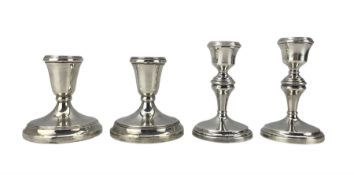 Pair of silver candlesticks with circular bases H12cm Birmingham 1926 and another pair H10cm (4)