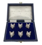 Set of six cast silver menu holders formed as fox heads