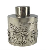 Edwardian silver tea caddy of oval form embossed with a procession of musicians