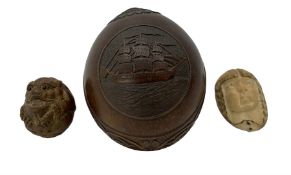 Coconut shell carved with a 19th century three masted sailing ship