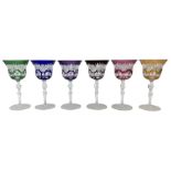 Set of six Bohemian Harlequin cut glass wine glasses with bell shaped bowls on faceted baluster stem