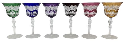 Set of six Bohemian Harlequin cut glass wine glasses with bell shaped bowls on faceted baluster stem