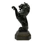20th century bronzed metal figure of a Lion sejant on a bronze canted rectangular plinth base