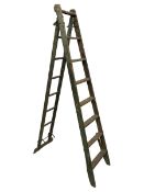 Pair early 20th century wooden and metal ladders