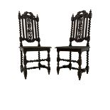 Pair of 19th century Jacobean Revival heavily carved oak hall chairs