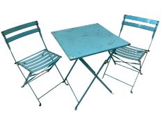 Blue painted metal garden table and two folding chairs