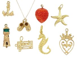 Eight 9ct gold pendant / charms including Luckenbooth