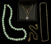 Gold stone set pendant necklaces and a gold curb link chain necklace