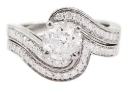 Platinum single stone round brilliant cut diamond crossover ring