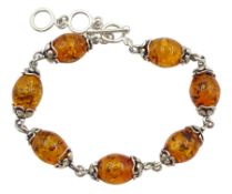 Silver oval Baltic amber link bracelet