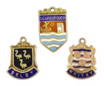 Three 9ct gold town shield charms including Scarborough