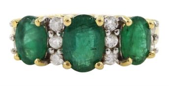 18ct gold three stone oval cut emerald and round brilliant cut diamond ring