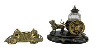 19th century novelty brass and ebonised inkwell modelled as a lion towing a cart