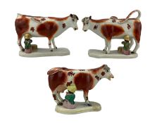 Pair of Victorian Staffordshire cow creamers