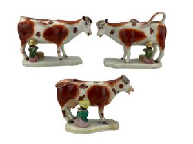 Pair of Victorian Staffordshire cow creamers