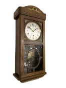 Vedette - French 20th century 8-day wall clock in an oak case