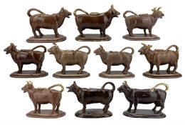 Ten 19th century brown glazed cow creamers