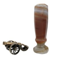 9ct rose gold and silver cannon charm and a 19th century banded carnelian agate desk seal
