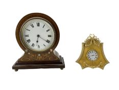A late 19th century French bedside table clock and a late 20th century English bedside strut clock.