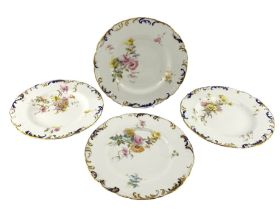Set of four late Victorian Royal Crown Derby plates each painted with Spring flowers within a moulde