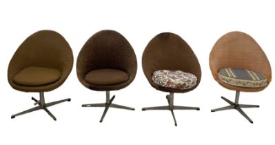 Set of four mid-20th century upholstered swivel tub chairs