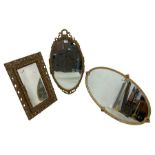 Oval gilt framed wall mirror (69cm x 38cm); rectangular gilt framed wall mirror (53cm x 35cm); and a