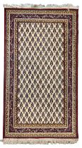 Antique Persian ivory ground rug