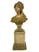 Composite stone bust of a girl looking right